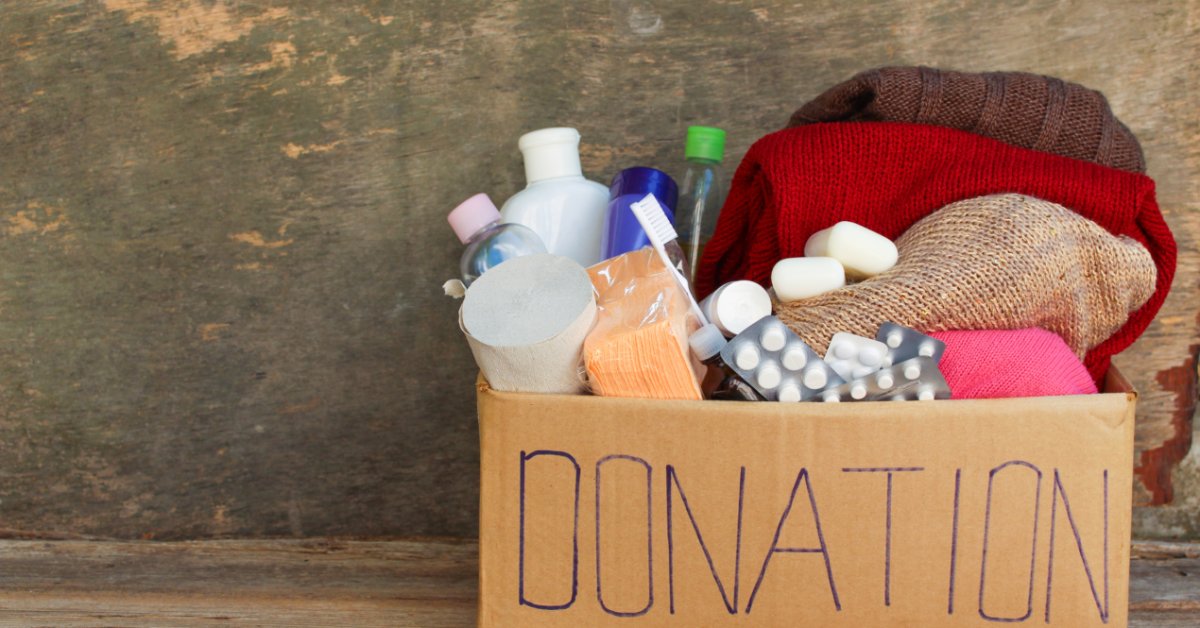 A donation box holds winter clothing and personal care supplies ready for distribution to people in need.